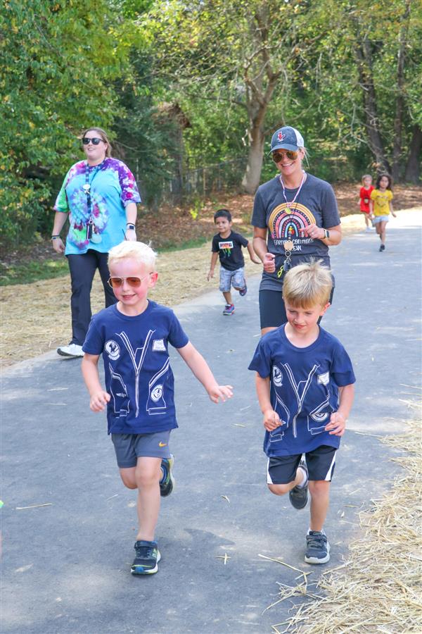 Students participating in a Hawk Walk around the track. 